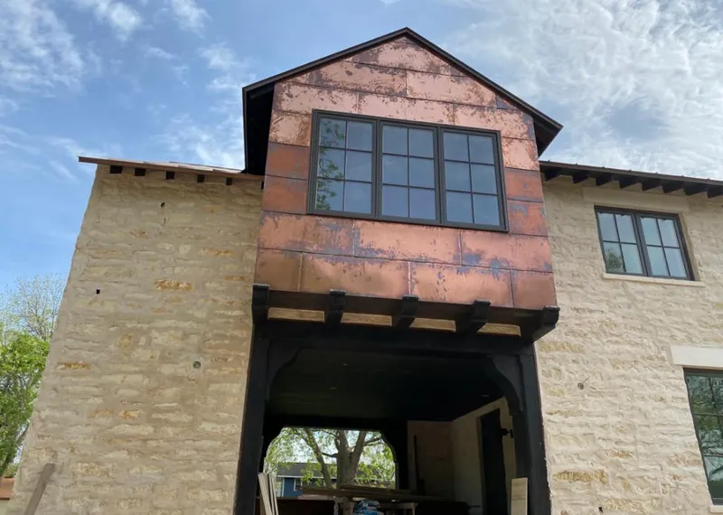 Copper metal panel facade on a stone building for Metal Roof Coating in Boonville