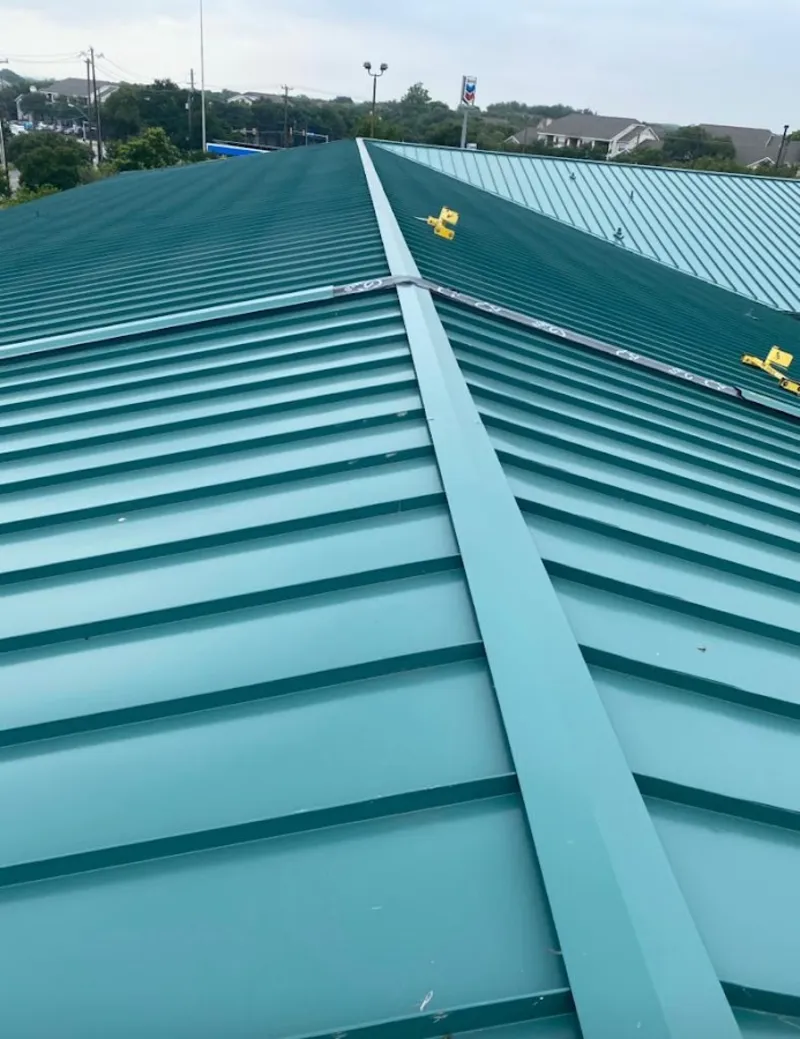 Green commercial metal roof ridge and valley for Metal Roof Repair in Boonville